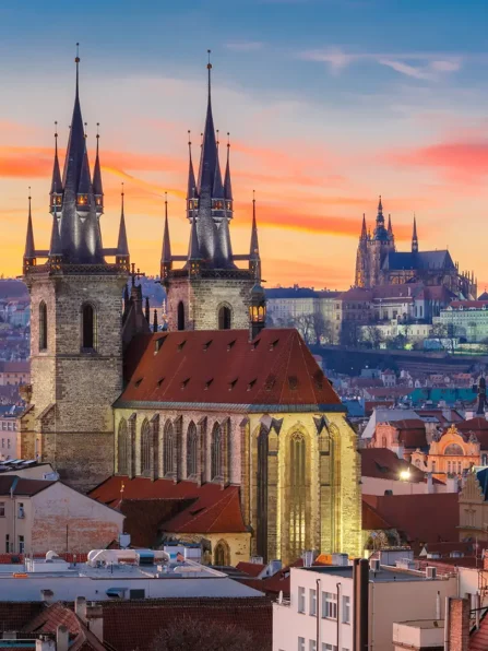 Aerial view over Church of Our Lady before Tyn, Old Town and Prague Castle at sunset in Prague, Czech Republic